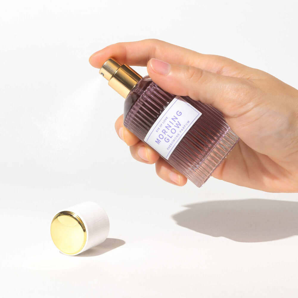 Morning Glow perfume bottle held in hand (EOL-P-03DX_2)